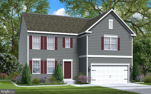 view of front of home featuring a front lawn and a garage