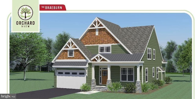 view of front of house featuring a porch, a front yard, and a garage