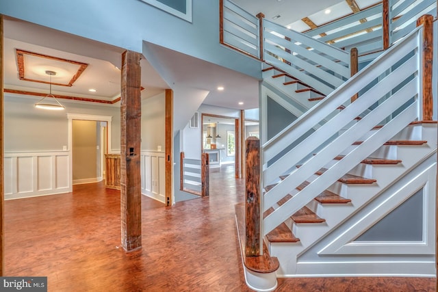 stairs featuring dark hardwood / wood-style flooring