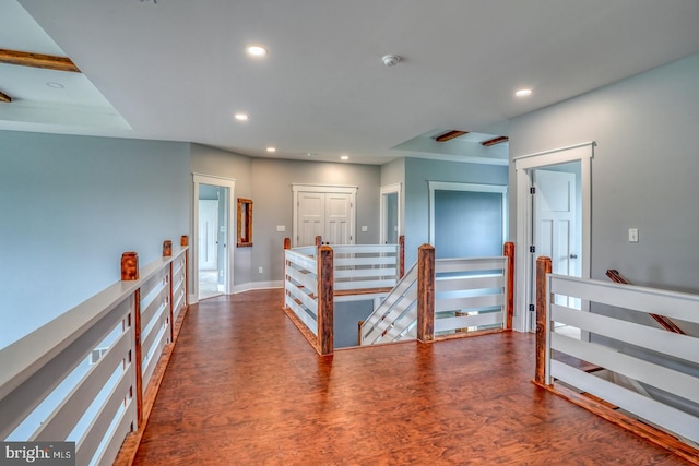 corridor with dark hardwood / wood-style floors