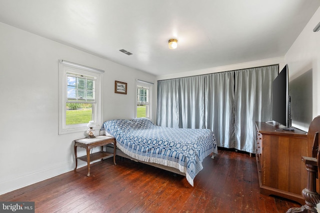 bedroom featuring dark wood-type flooring