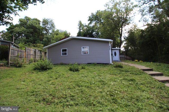 view of home's exterior featuring a yard