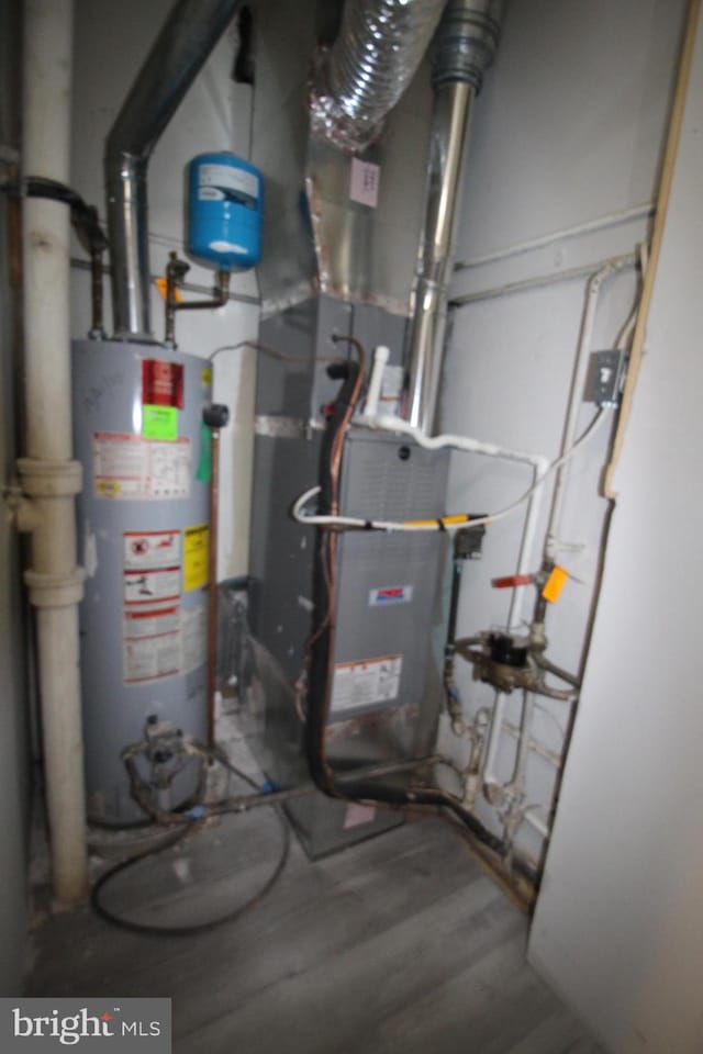 utility room featuring gas water heater