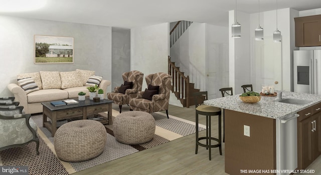 living room featuring light hardwood / wood-style floors and sink