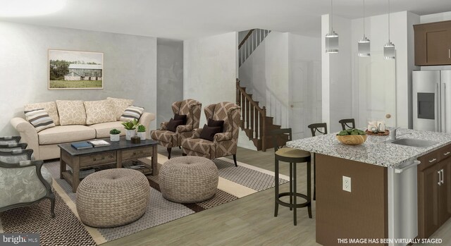 living room with sink and light hardwood / wood-style flooring