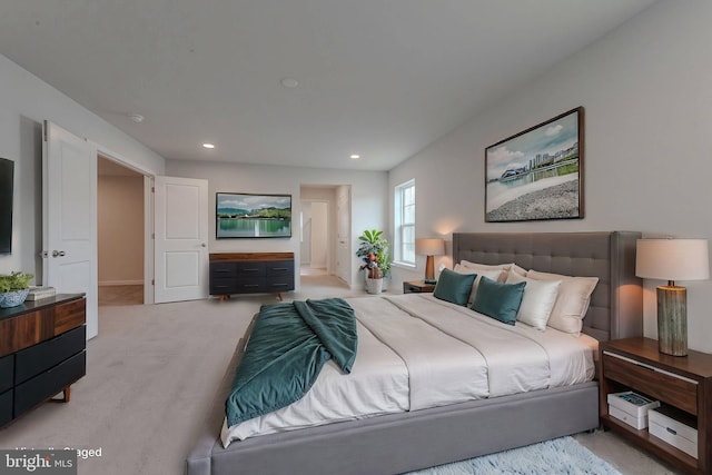 bedroom featuring light carpet