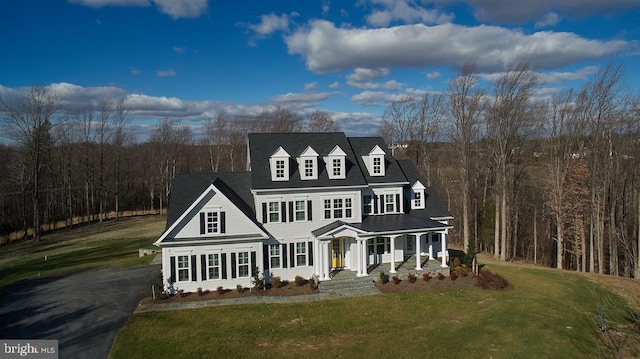 view of front of home featuring a porch and a front lawn