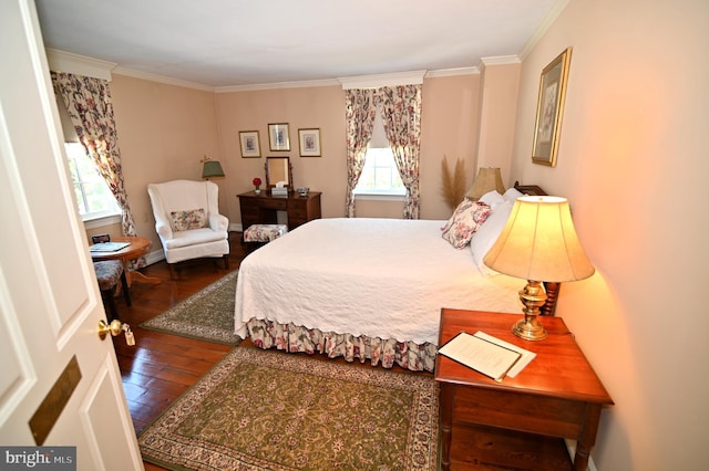 bedroom featuring crown molding and dark wood-type flooring