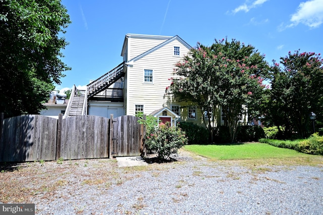 view of property exterior featuring a lawn