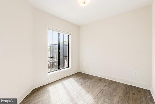 empty room with light hardwood / wood-style floors