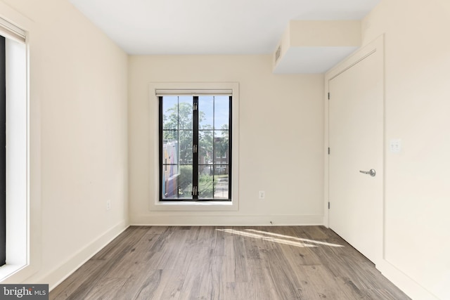 empty room featuring dark hardwood / wood-style flooring