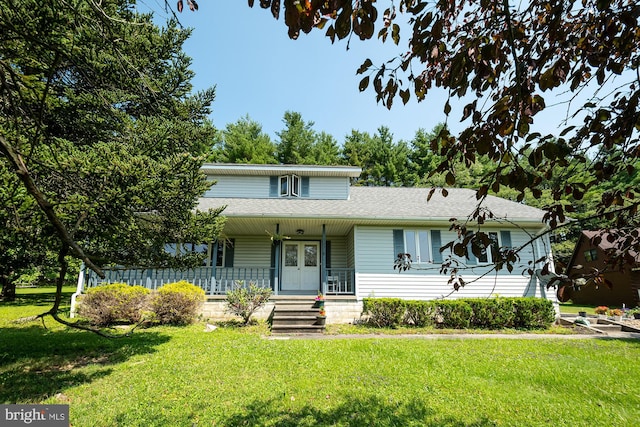 view of front facade featuring covered porch and a front yard