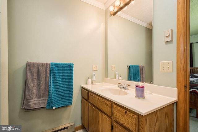 bathroom featuring a textured ceiling, ornamental molding, and vanity