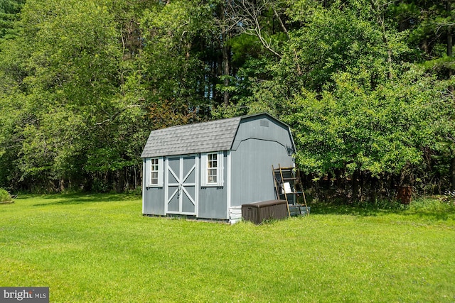 view of shed / structure featuring a yard