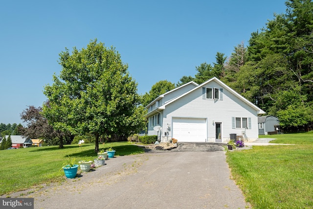 view of front of property with a front lawn and a garage