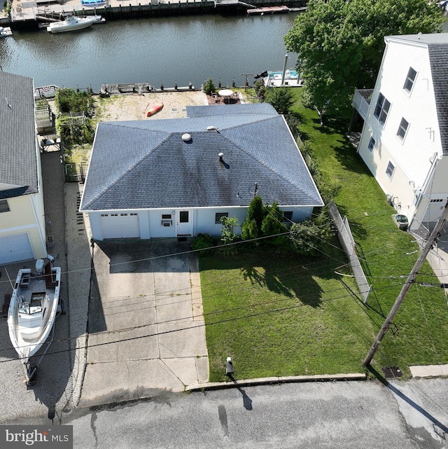 drone / aerial view with a water view