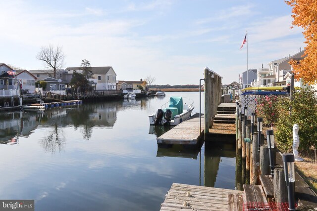 dock area featuring a water view