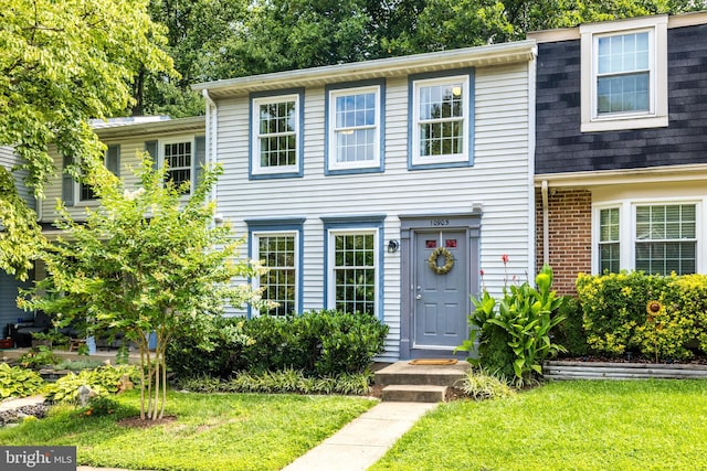 10905 Harpers Square Ct, Reston, VA 20191 - view of front of property with a front lawn and roof with shingles