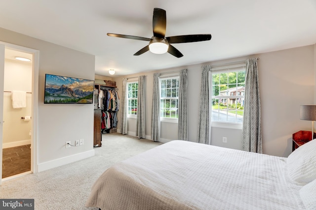 10905 Harpers Square Ct, Reston, VA 20191 - carpeted bedroom with ensuite bath, a closet, baseboards, a spacious closet, and a ceiling fan