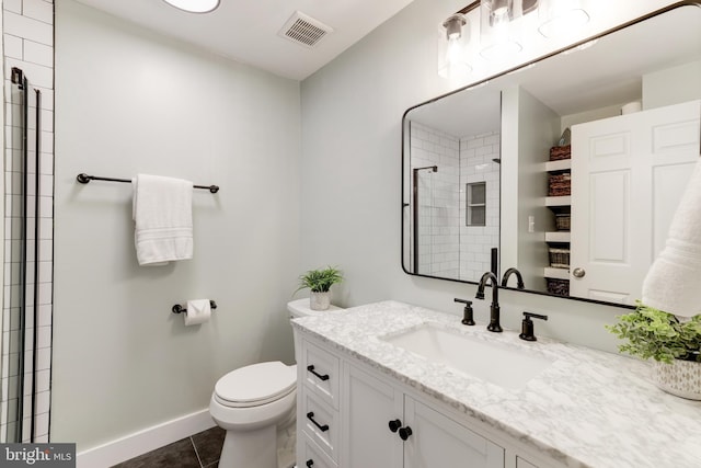 10905 Harpers Square Ct, Reston, VA 20191 - bathroom with visible vents, toilet, tile patterned floors, vanity, and tiled shower