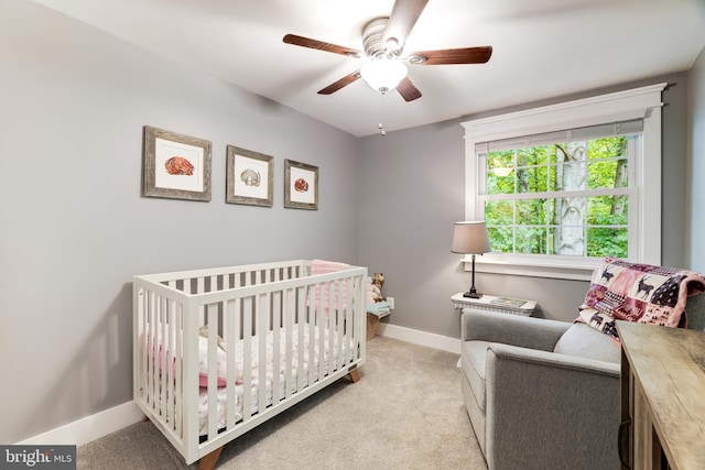 10905 Harpers Square Ct, Reston, VA 20191 - carpeted bedroom with a crib, ceiling fan, and baseboards