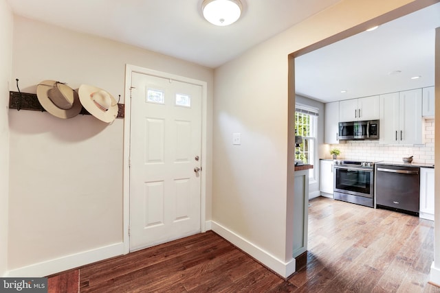 10905 Harpers Square Ct, Reston, VA 20191 - entryway featuring wood finished floors and baseboards