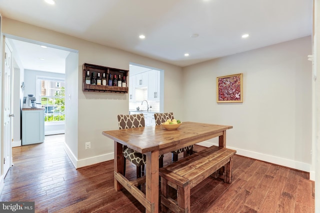 10905 Harpers Square Ct, Reston, VA 20191 - dining room featuring recessed lighting, wood finished floors, and baseboards