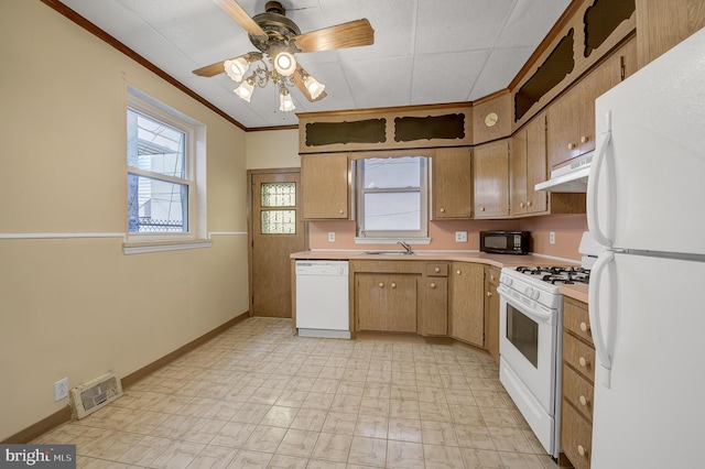 kitchen featuring ceiling fan, white appliances, light tile floors, sink, and crown molding