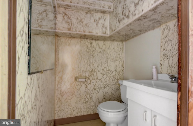 bathroom featuring tile flooring, toilet, and oversized vanity