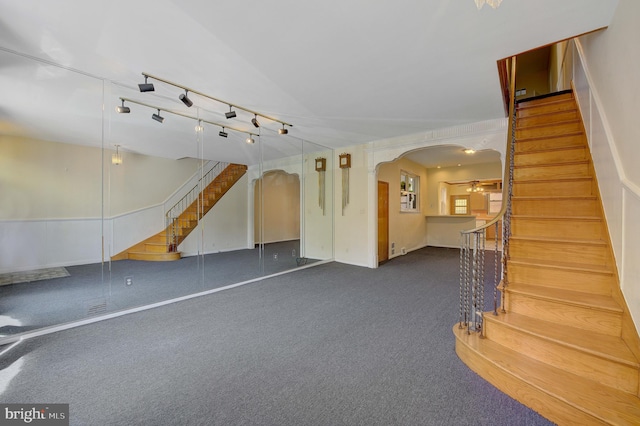 interior space with dark colored carpet