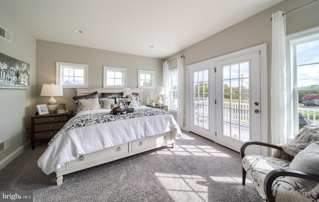 carpeted bedroom featuring access to exterior