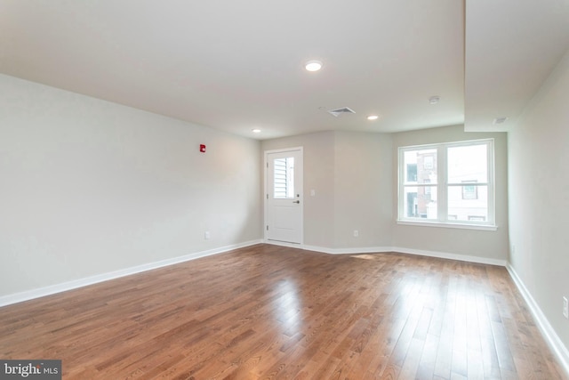 empty room with light hardwood / wood-style floors