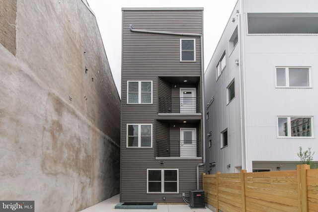 modern home with a balcony and central AC