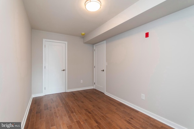 empty room featuring dark hardwood / wood-style floors