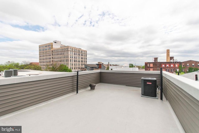 view of patio featuring a balcony and central air condition unit