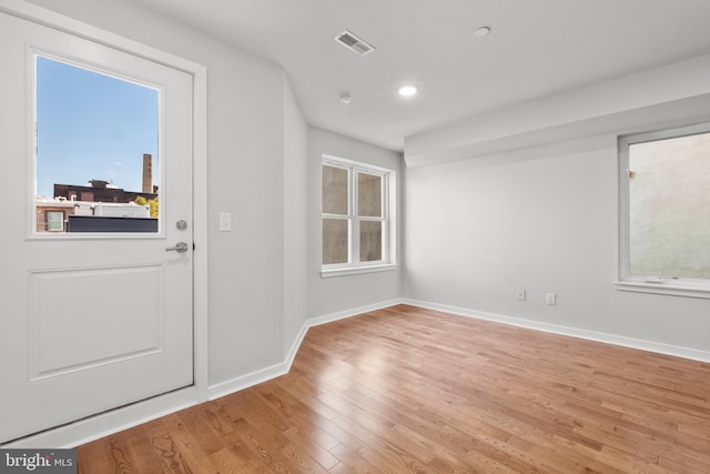 spare room with light wood-type flooring