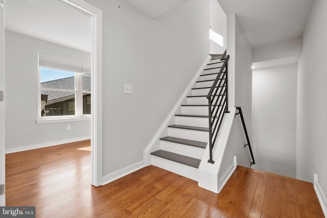 staircase featuring light hardwood / wood-style flooring