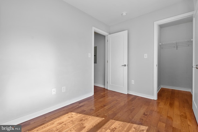 unfurnished bedroom with light hardwood / wood-style floors and a closet