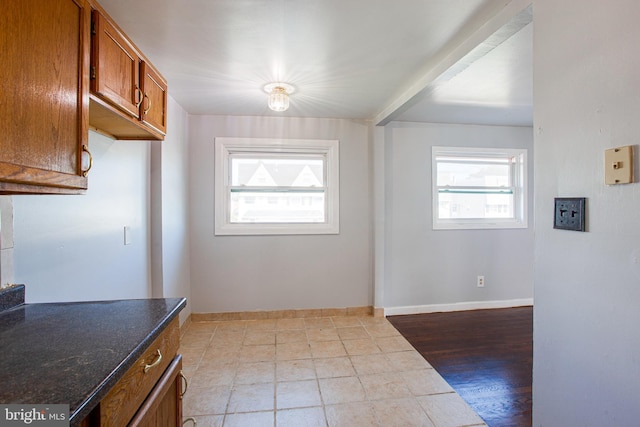 interior space featuring light tile floors