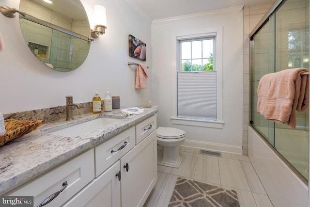 full bathroom with toilet, ornamental molding, tile floors, shower / bath combination with glass door, and vanity