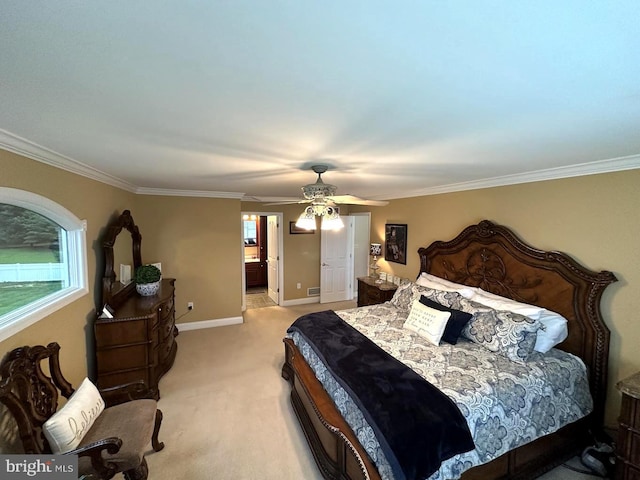 carpeted bedroom with connected bathroom, ceiling fan, and crown molding