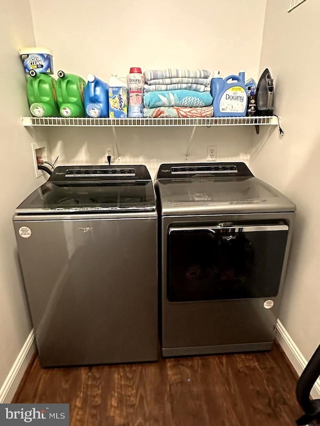 washroom featuring washer hookup, dark hardwood / wood-style floors, and independent washer and dryer