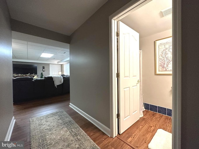 corridor with dark wood-type flooring