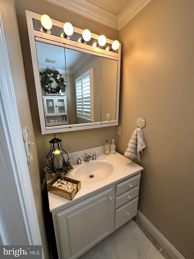 bathroom featuring vanity and crown molding