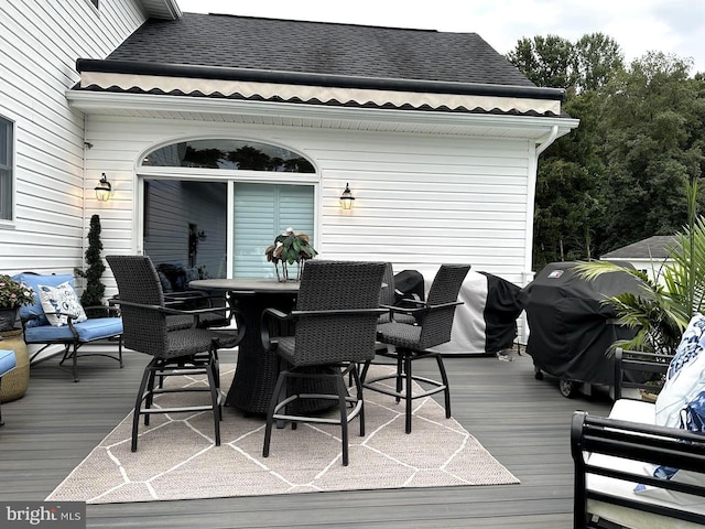 wooden terrace featuring grilling area