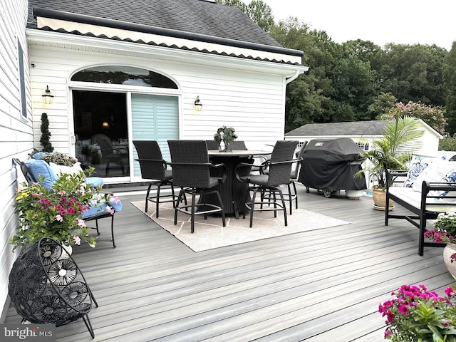 wooden terrace with area for grilling