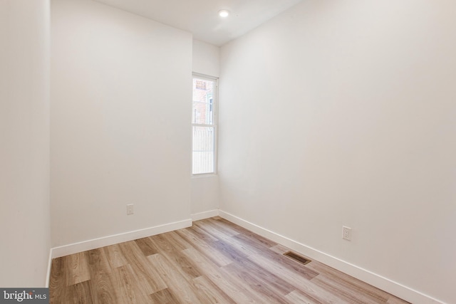 spare room featuring light hardwood / wood-style flooring