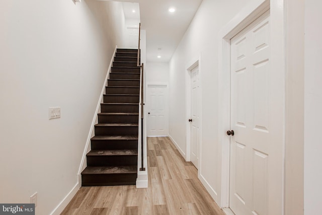 stairway featuring hardwood / wood-style floors