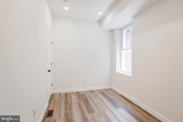 unfurnished room featuring light wood-type flooring