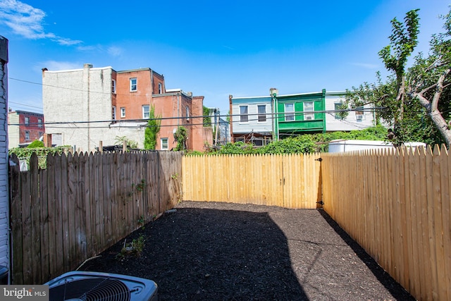 view of yard with central AC